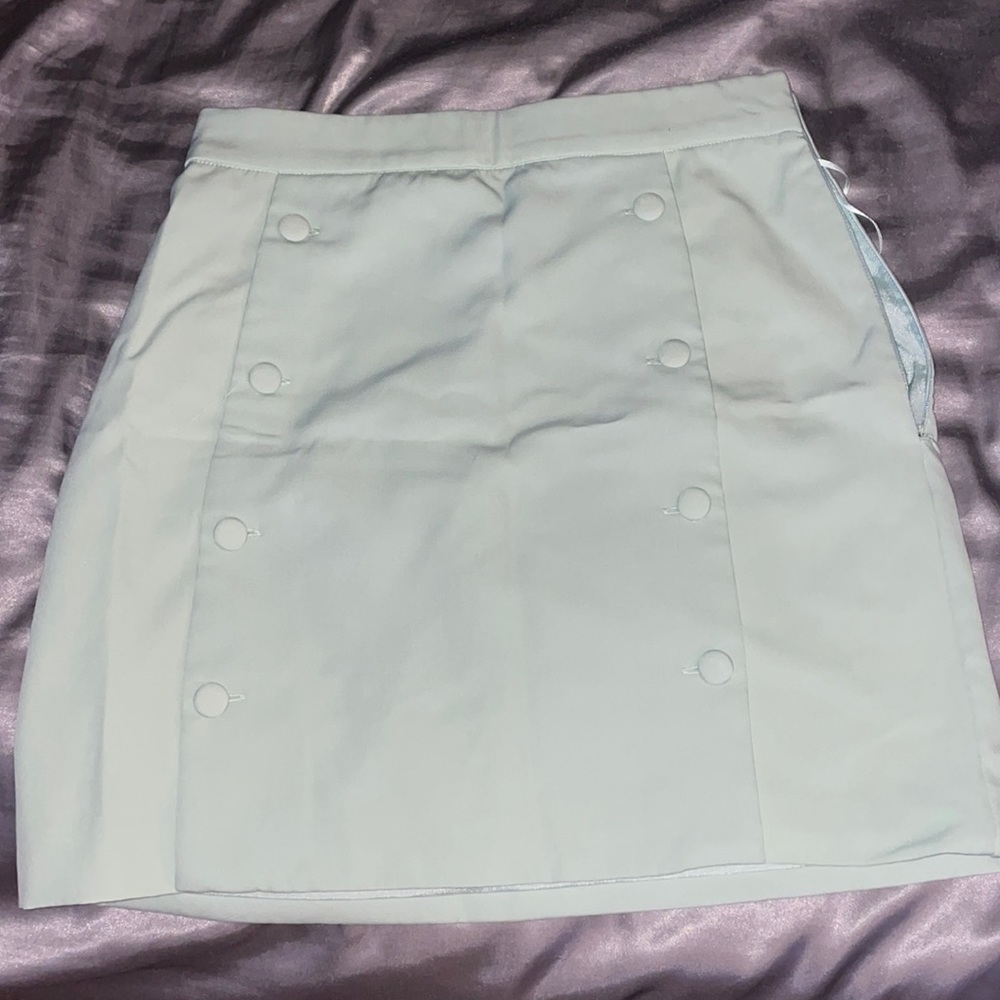 Meshki Super cute skirt size small. Perfect condition just too small.
